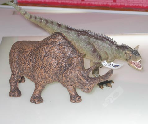 The Papo Woolly Rhino model and the Papo Carnotaurus.