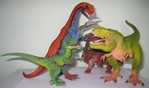 Different coloured dinosaur models.