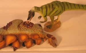 A Saurophaganax has killed a Stegosaurus.