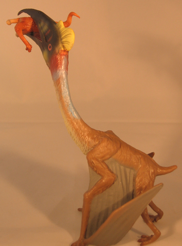 A Quetzalcoatlus has snatched up a baby dinosaur.