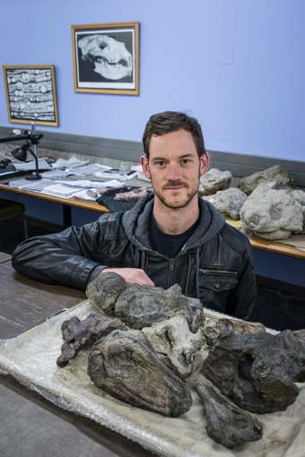 Dr. Michael Day and some of the fossils used in the study.