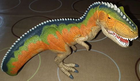 The Schleich Giganotosaurus dinosaur model.