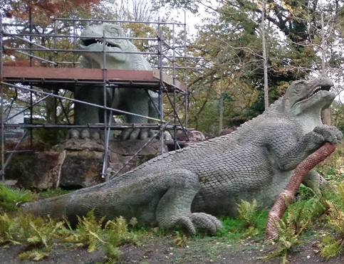 A pair of Iguanodons study the Crystal Palace landscape.