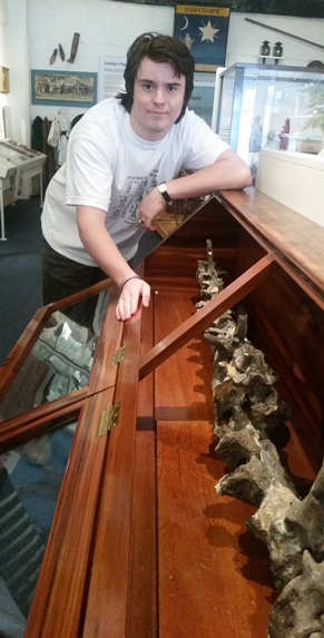 Tom a pupil at Reigate Grammar School oversees the cataloguing of the dinosaur bones.