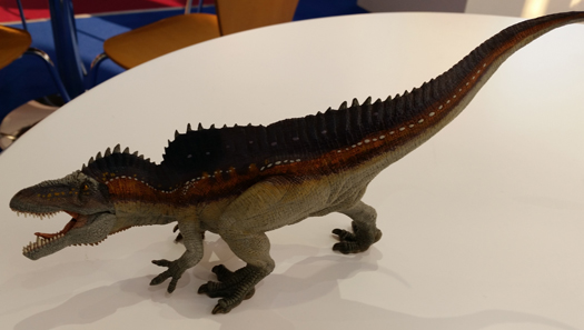 The Papo Acrocanthosaurus dinosaur model.