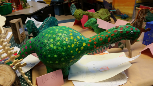Dinosaur and prehistoric animal figures in the classroom.