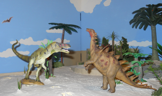 The CollectA Dacentrurus battles a CollectA Torvosaurus.