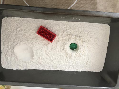 Testing the impact of different objects in flour - asteroid impact modellling.