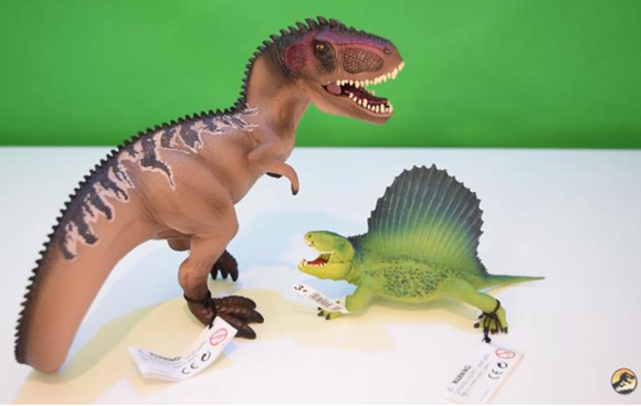 A Schleich Dimetrodon and a Schleich Giganotosaurus.