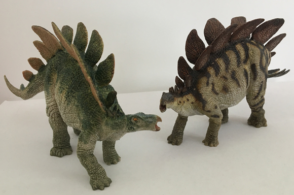 Two Papo Stegosaurus figures.