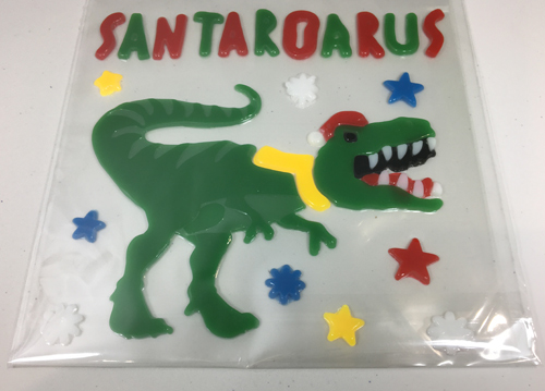 A seasonal decoration with a dinosaur theme - a festive T. rex.