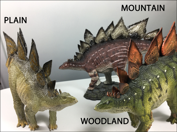 A trio of three Rebor Stegosaurus (S. armatus) models.