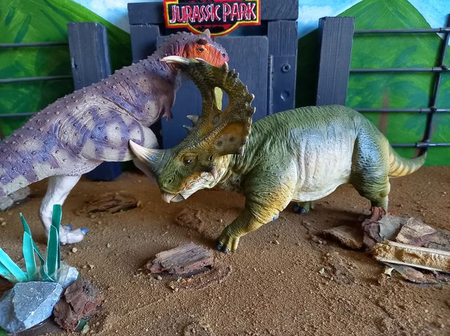Carnotaurus battles Sinoceratops.