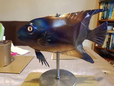 A metallic fish model.