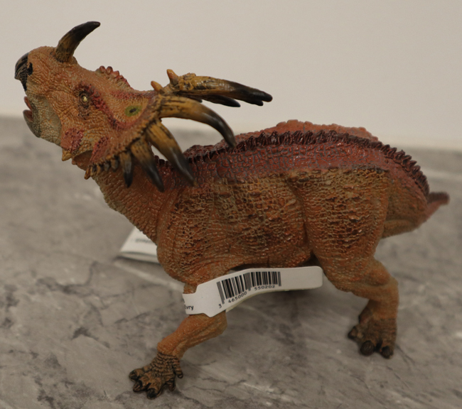 Papo red Styracosaurus in left lateral view.