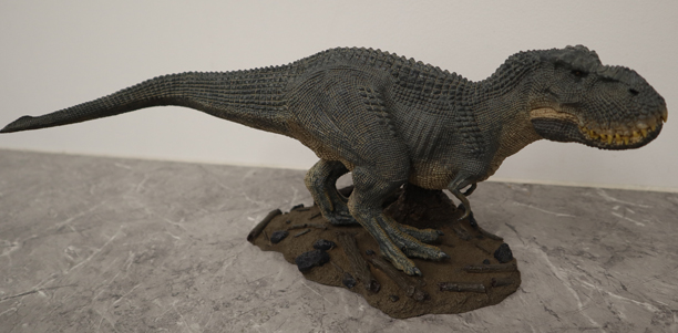 A Rebor tyrannosaur model on the Winter Tears display base.