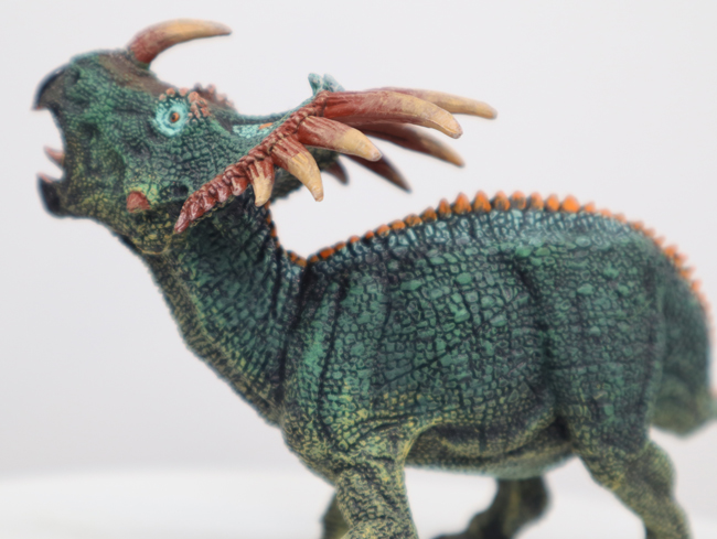 Papo green Styracosaurus dinosaur model.