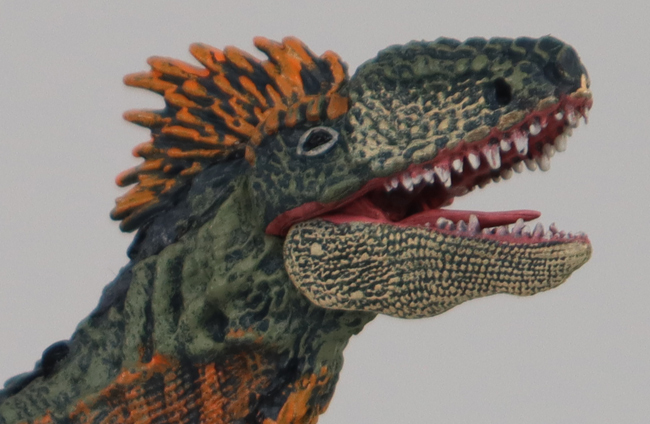 A close-up view of the Papo Concavenator dinosaur model.