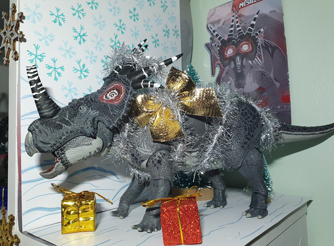 A Styracosaurus model decorated for Christmas.