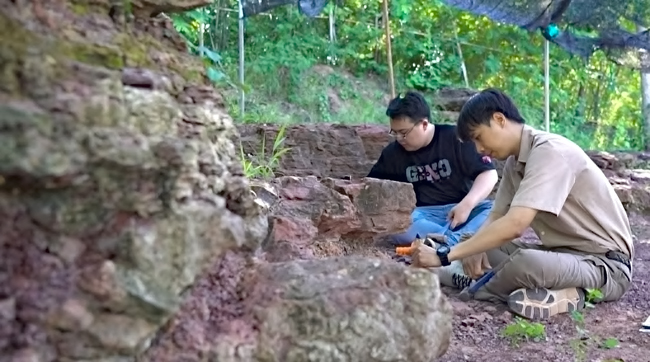 Field team members exploring the pond location looking for Nagatitan fossil material.