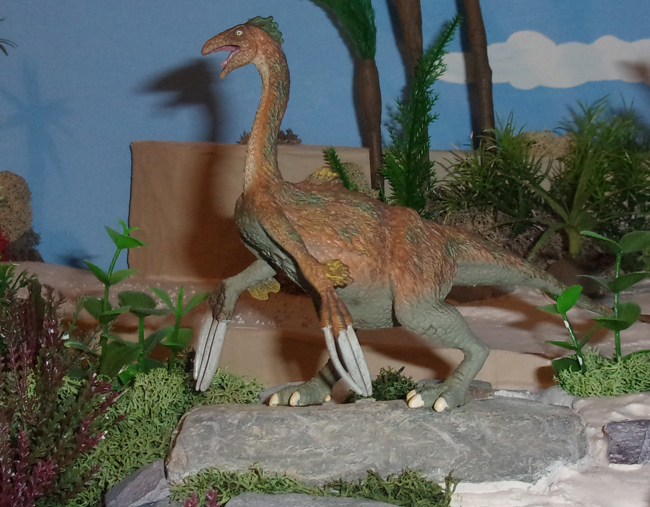 The CollectA Therizinosaurus model features in a diorama.